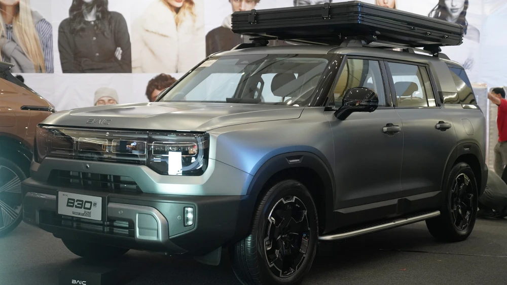 A BAIC B30e DUNE showcased at the UAAGI auto event, joining Lynk & Co Philippines in championing premium hybrid vehicles.